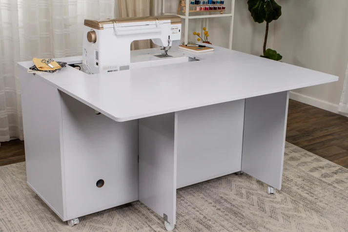 Spacious white sewing cabinet with built-in sewing machine and storage compartments